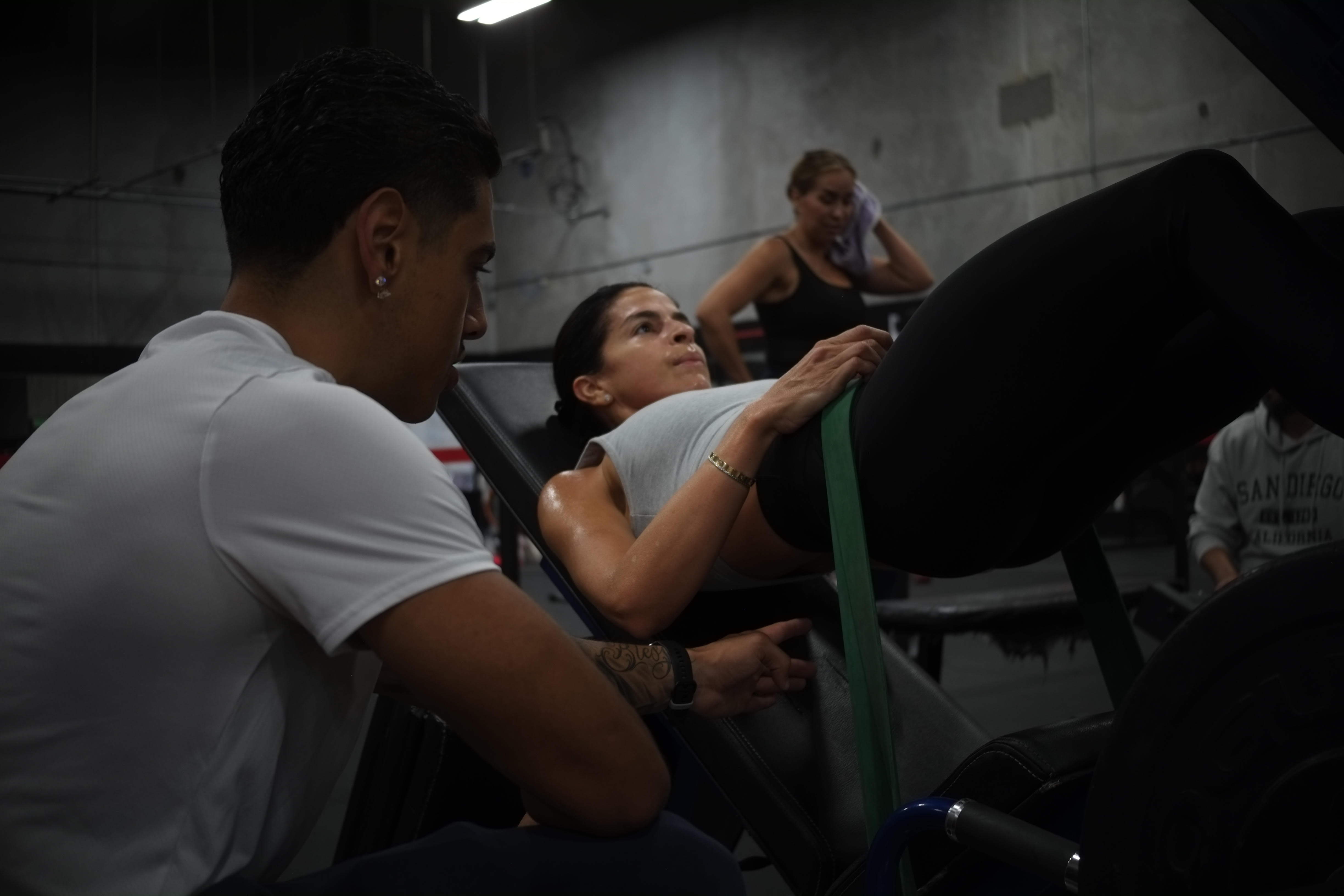 Spotting a client on a leg press